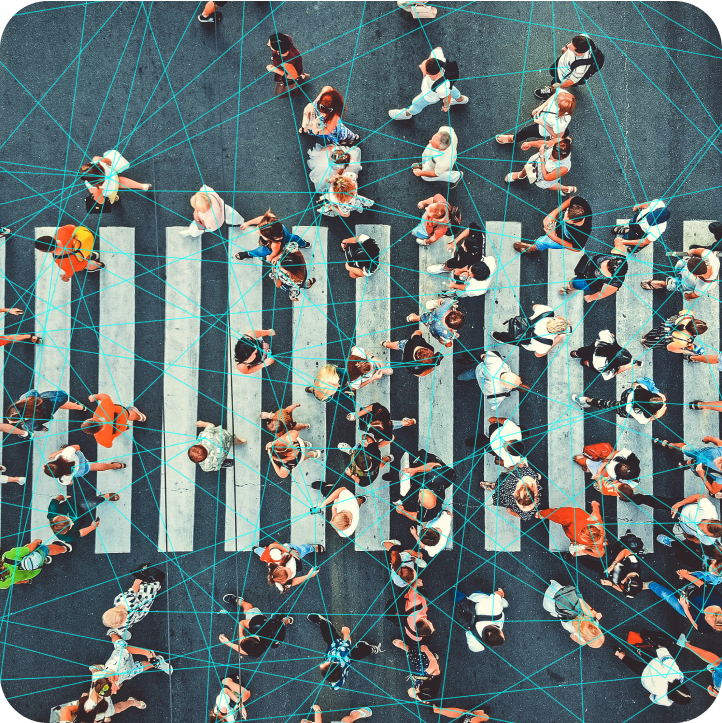 Aerial view of a busy crosswalk with digital network lines connecting pedestrians.
