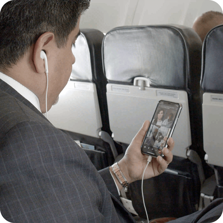 Man on virtual call on plane