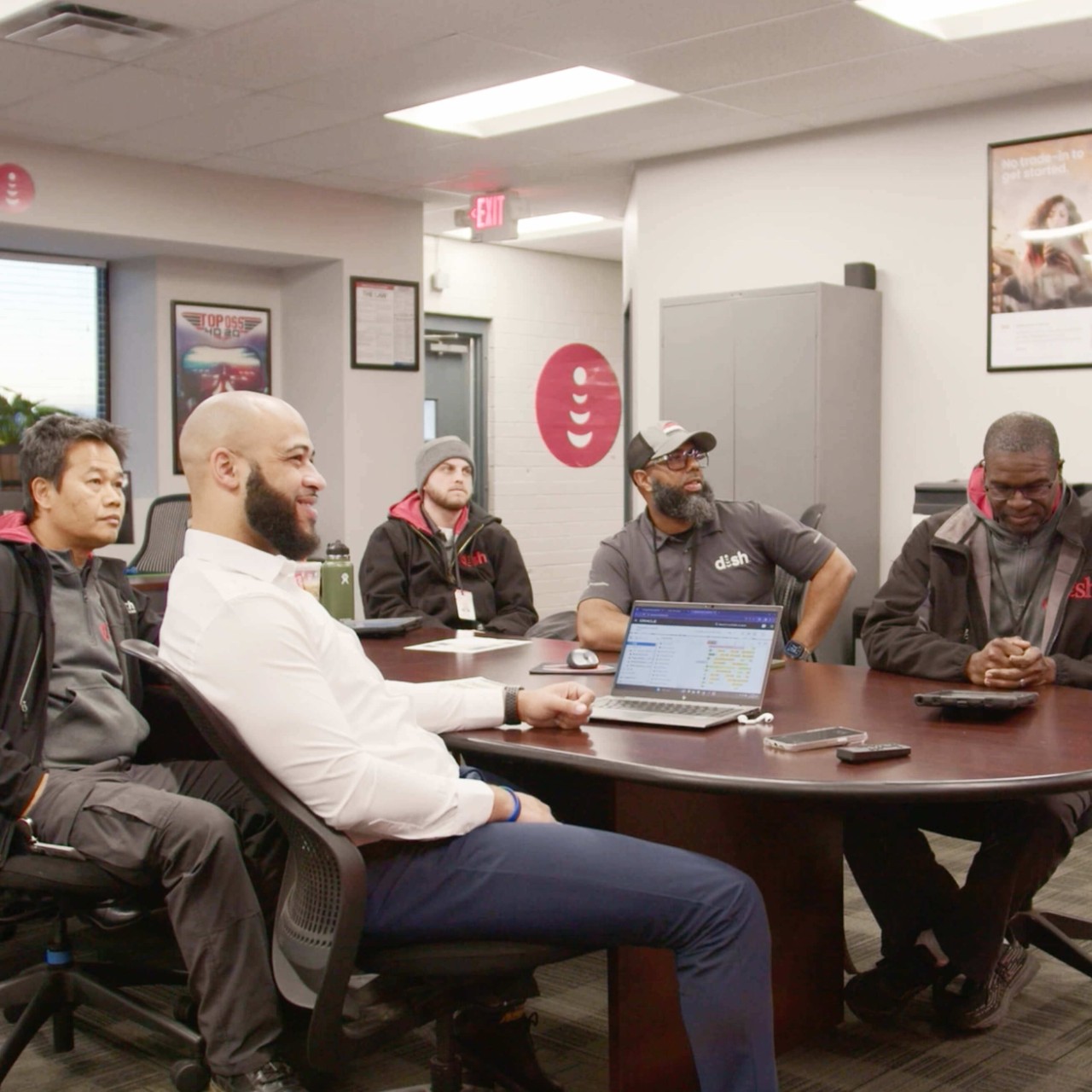 Techs brainstorming at a conference table