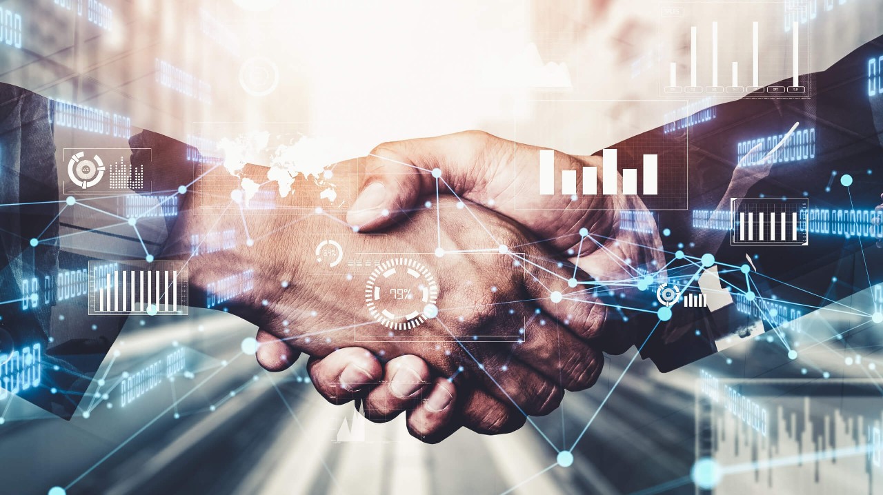 Image of handshake with tech ymbols around it