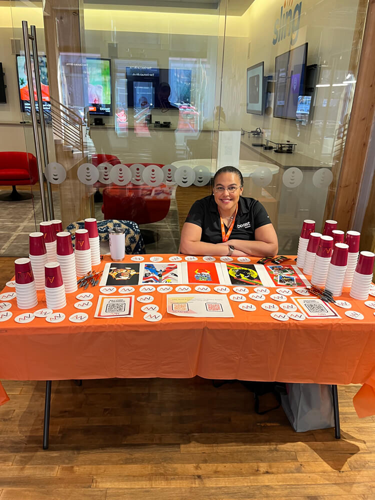 Woman seated at welcoming table